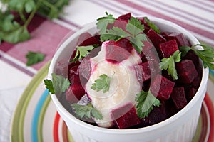 Salad of boiled beets with horseradish in bowl