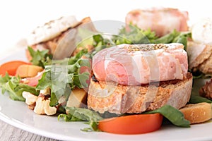 Salad, bread and cheese with bacon