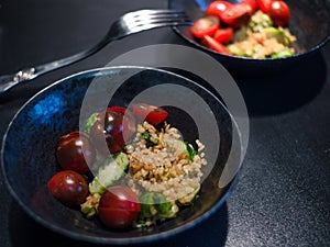 Salad with bulgur and vegetables, tomatoes and Brussels sprouts.