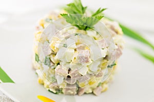 Salad from canned corn, sausage, eggs and onion