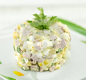 Salad from canned corn, sausage, eggs and onion