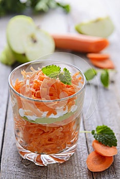Salad from carrot and apple served in glass