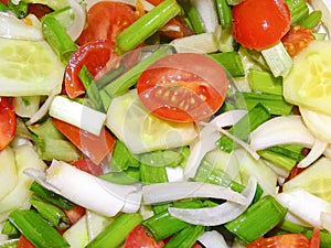 Salad with cherry tomatoes, onions, cucumbers and cold-pressed sunflower oil