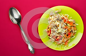 Salad with chicken stomachs with vegetables carrots, onions, peppers, cabbage, tomato, broccoli . salad with chicken on a green