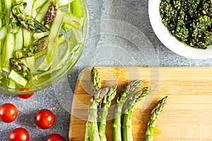 Salad components, asparagus, cherry tomatoes, pesto