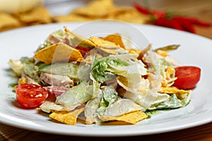 Salad with corn, beans, avocado and nachos.