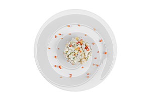 Salad with corn and bell pepper on plate white isolated