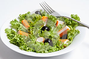 Salad of crab sticks photo