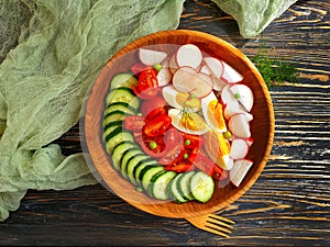 Salad cucumbers, tomatoes diet , summer homemade antioxidant eggs dinner cuisine a wooden background