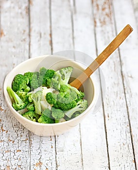 Salad in a deep bowl, broccoli, pepper and apple
