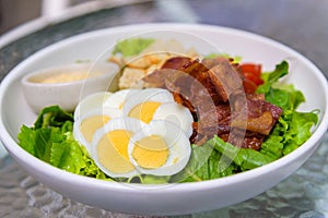 Salad with eggs, bacon and crouton, healthy food cuisine meal