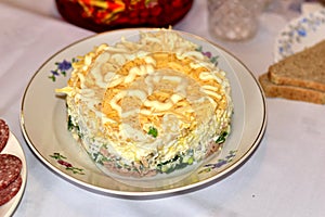 Salad with tuna and cheese on a plate photo