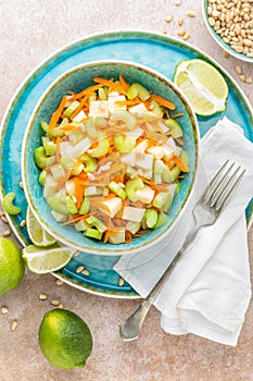 Salad with fresh celery, apple and carrot