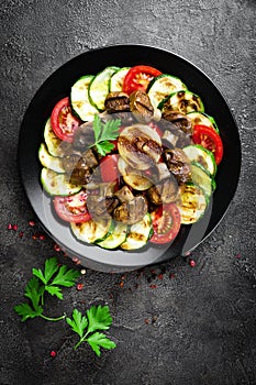 Salad with fresh and grilled vegetables and mushrooms. Vegetable salad with grilled champignons. Vegetable salad