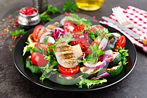 Salad with fresh and grilled vegetables and mushrooms. Vegetable salad with grilled champignons. Vegetable salad on plate