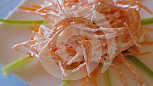 salad with fresh julienne carrots, garlic and sour cream