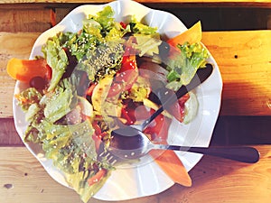 Salad. Fresh summer lettuce salad.Healthy mediterranean salad on wooden table. Vegetarian food.