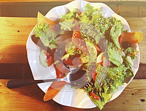 Salad. Fresh summer lettuce salad.Healthy mediterranean salad on wooden table. Vegetarian food