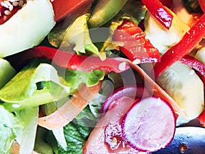 Salad. Fresh summer lettuce salad.Healthy mediterranean salad on wooden table. Vegetarian food