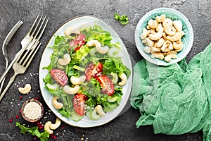 Salad with fresh vegetables and nuts. Vegetable salad with fresh vegetables and cashew. Vegetable salad on plate