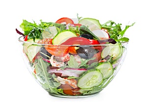 Salad with fresh vegetables, olives and shrimp isolated on white