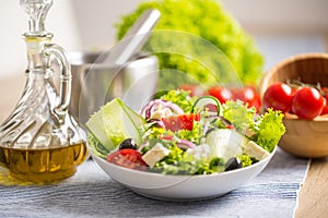 Salad with fresh vegetables olives tomatoes red onion greek cheese feta and olive oil