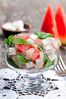 Salad with fresh watermelon and feta with basil and spinach lea