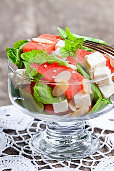 Salad with fresh watermelon and feta with basil and spinach lea