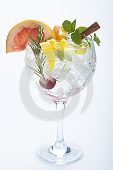 Salad fruit gin tonic isolated over white photo
