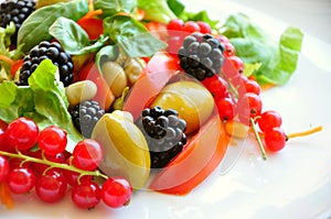 Salad with fruit and vegetables: raw food diet photo