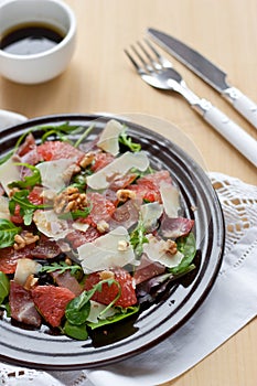 Salad with grapefruit parmesan and rucola