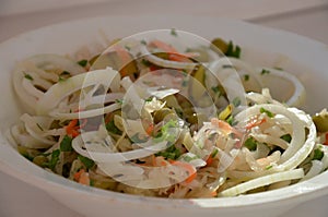 Salad with greenness, pea-coal, sauerkraut, onion , carrot