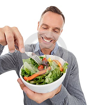 Salad, healthy eating and diet of a man in studio with vegetable food with nutrition for health. Happy model person with