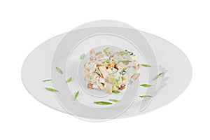 Salad with honey mushrooms and green onions on plate white isolated