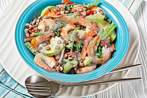 Salad of lentils  shrimps  wilted kale on a plate