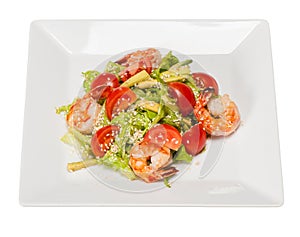 Salad with lettuce, shrimps, cherry tomatoes, avocado