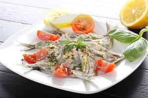 Salad marinated sardines with basil and tomato