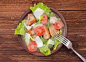 Salad with meat and tomatoes.