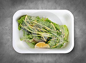 Salad mix of spaghetti with zucchini. Healthy food. Takeaway food. Top view, on a gray background