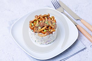 Salad with mushrooms honey fungus, ham, potatoes, cheese and mayonnaise.