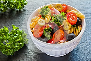 Salad: pasta fusilli, black and green olives, cherry tomatoes, red onion and parsley