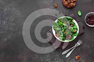 Salad with pecan nuts and dry cranberries