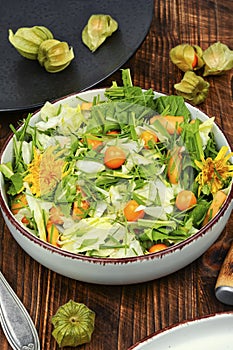 Salad with physalis and field grass