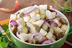 Salad with pickled cucumbers and apples