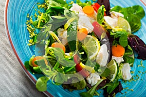 Salad with pickled merluccius