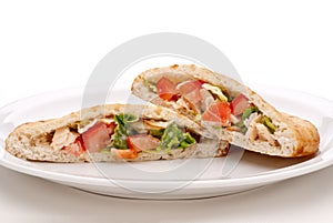 Salad in pita bread on a white plate