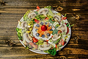 Salad Plate with Fruit Salad in the middle slight angle