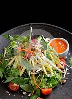 Salad plate with sour mango