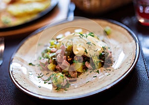 Salad with potatoes, sour cream and mushrooms