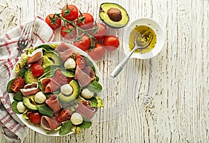 Salad prosciutto with cheese and avocado